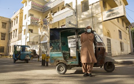 A rickshaw driver waits for passengers. Karachi, Pakistan..jpg