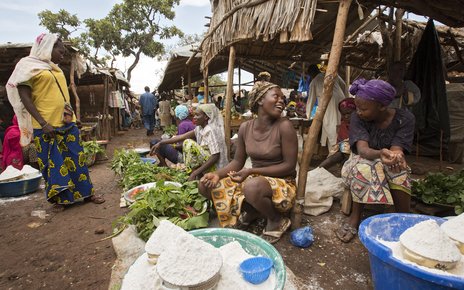 Women sell home-grown vegetables and cassava flour at the market in the Gado refugee camp, Cameroon